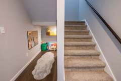 Stairway remodel for a basement with carpet