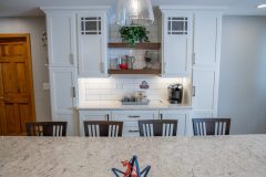 modern kitchen remodeled with white granite counters and cabinets, new steel appliances and lighting fixtures.modern kitchen remodeled with white granite counters and cabinets, new steel appliances and lighting fixtures.